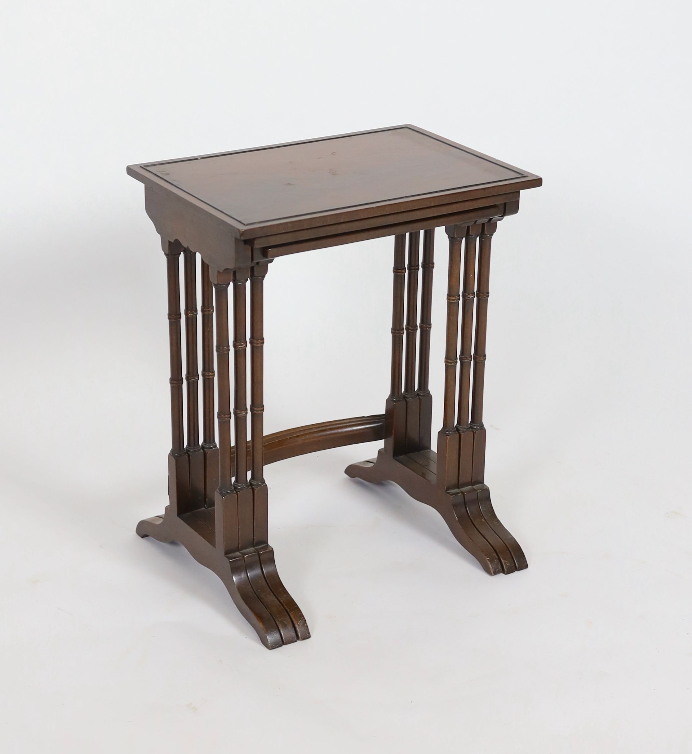 A nest of three rectangular mahogany tea tables, width 45cm depth 32cm height 67cm